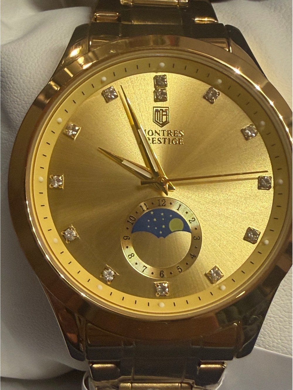 Montres Prestige gold-tone watch with moonphase dial